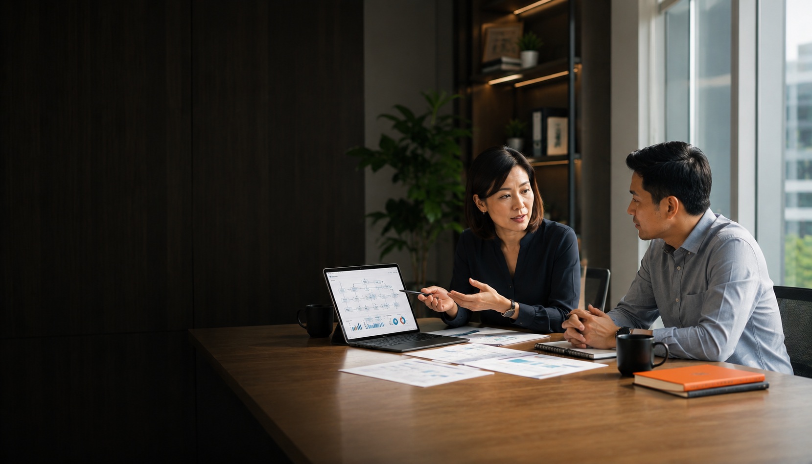 BPO Services Malaysia — People Profilers consultant reviewing business process workflow and operations dashboard with client
