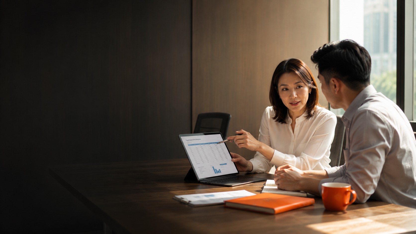 Payroll Outsourcing Malaysia — People Profilers payroll consultant reviewing monthly payslip report and statutory contributions with client